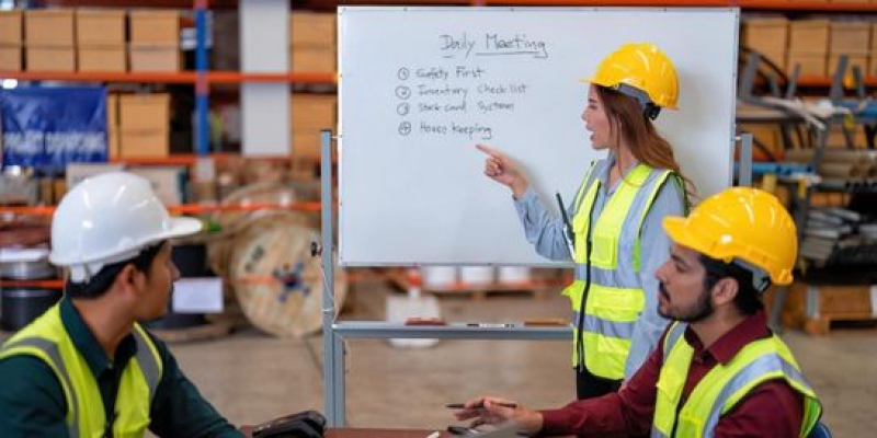 Supervisor having a morning briefing with employees