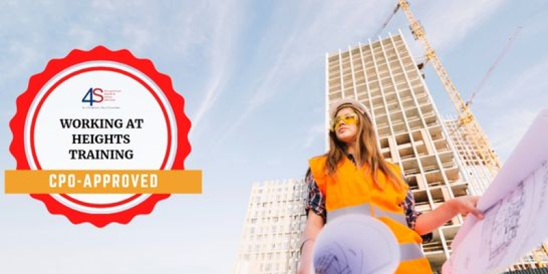 construction worker standing next to a building