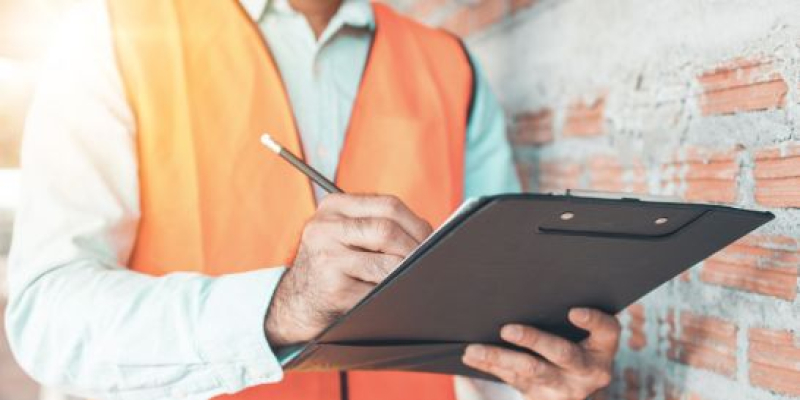 Man filling an accident investigation form