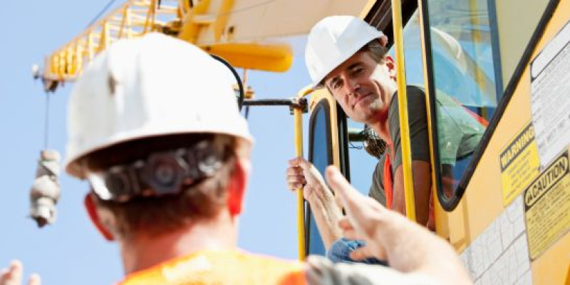 crane machine operator and his supervisor