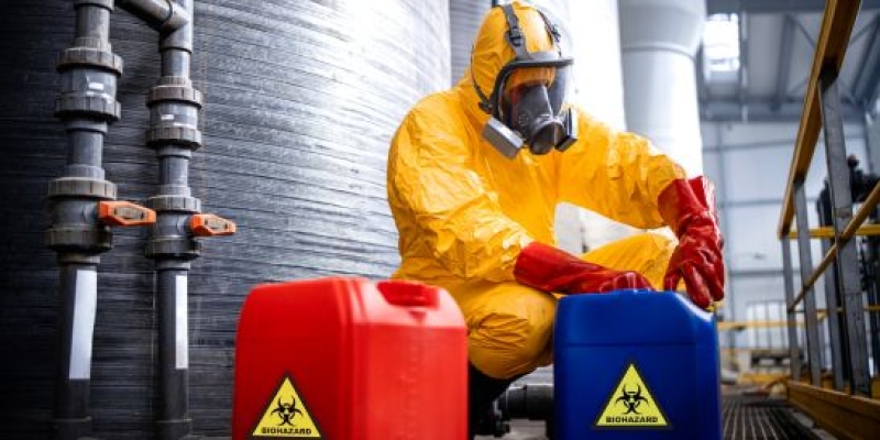 supervisor handling hazardous materials with care