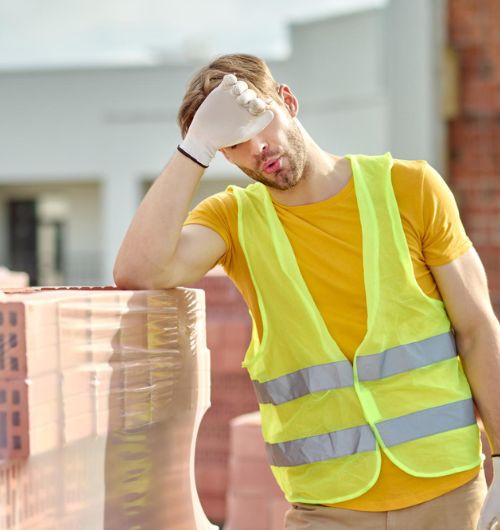 construction worker suffering from heat stress