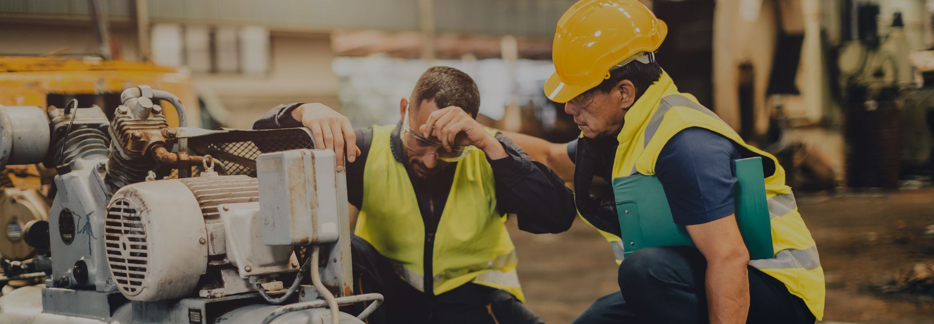 Supervisor helping an employee with his task